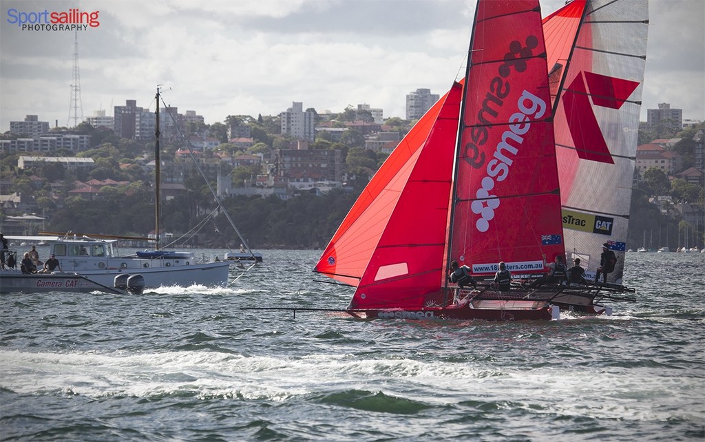 Smeg heads below and Pure Blonde stays above Gotta Luv it 7 on the finsh line of day 4 - 18ft Skiff JJ Giltinan Championships 2013 - Day 4  © Beth Morley - Sport Sailing Photography http://www.sportsailingphotography.com